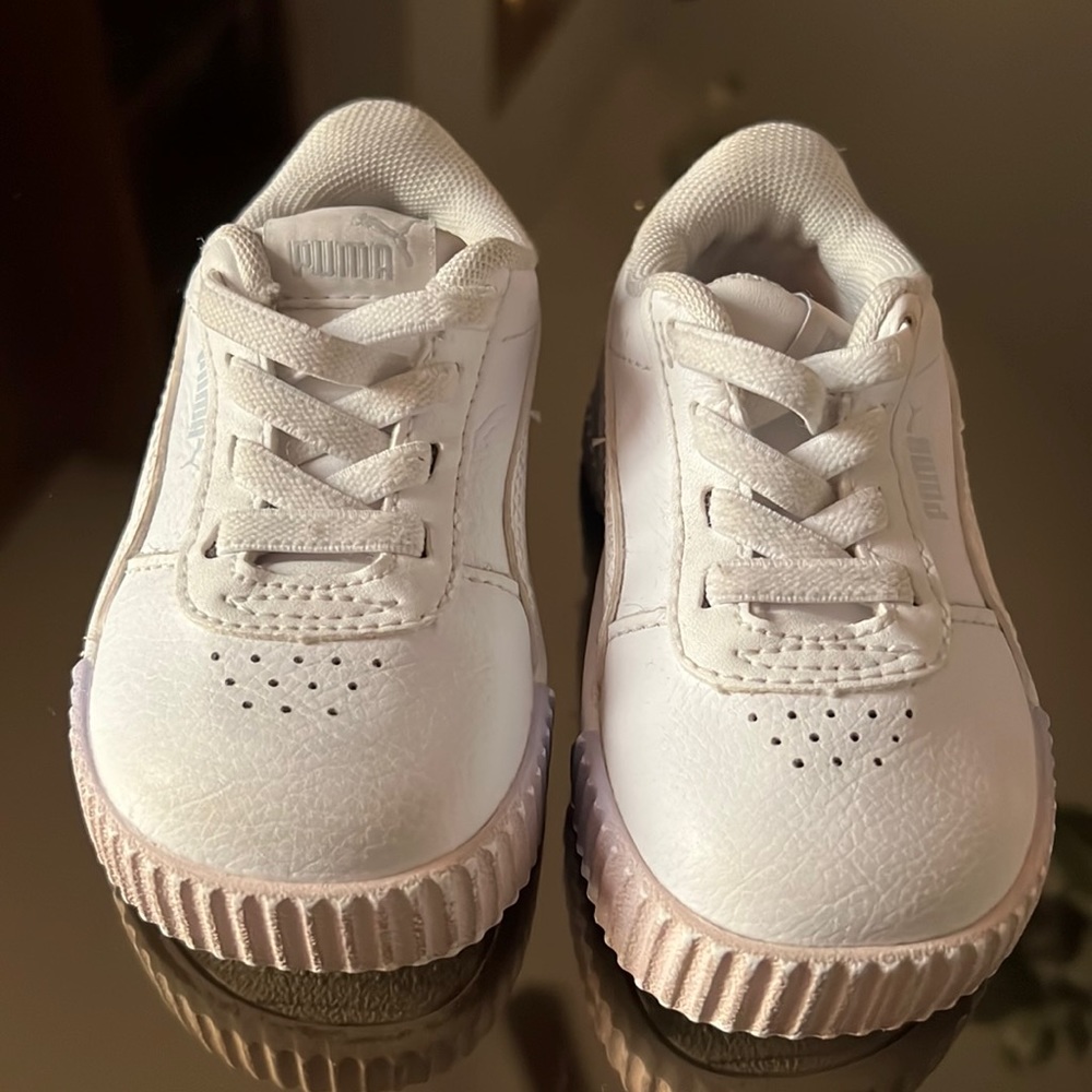White leather Puma sneaker in size 4C. Gently used.